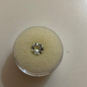 Very faint blue topaz round custom cut gem.